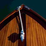Classic varnished yacht, overhead photo showing the bow of the boat.